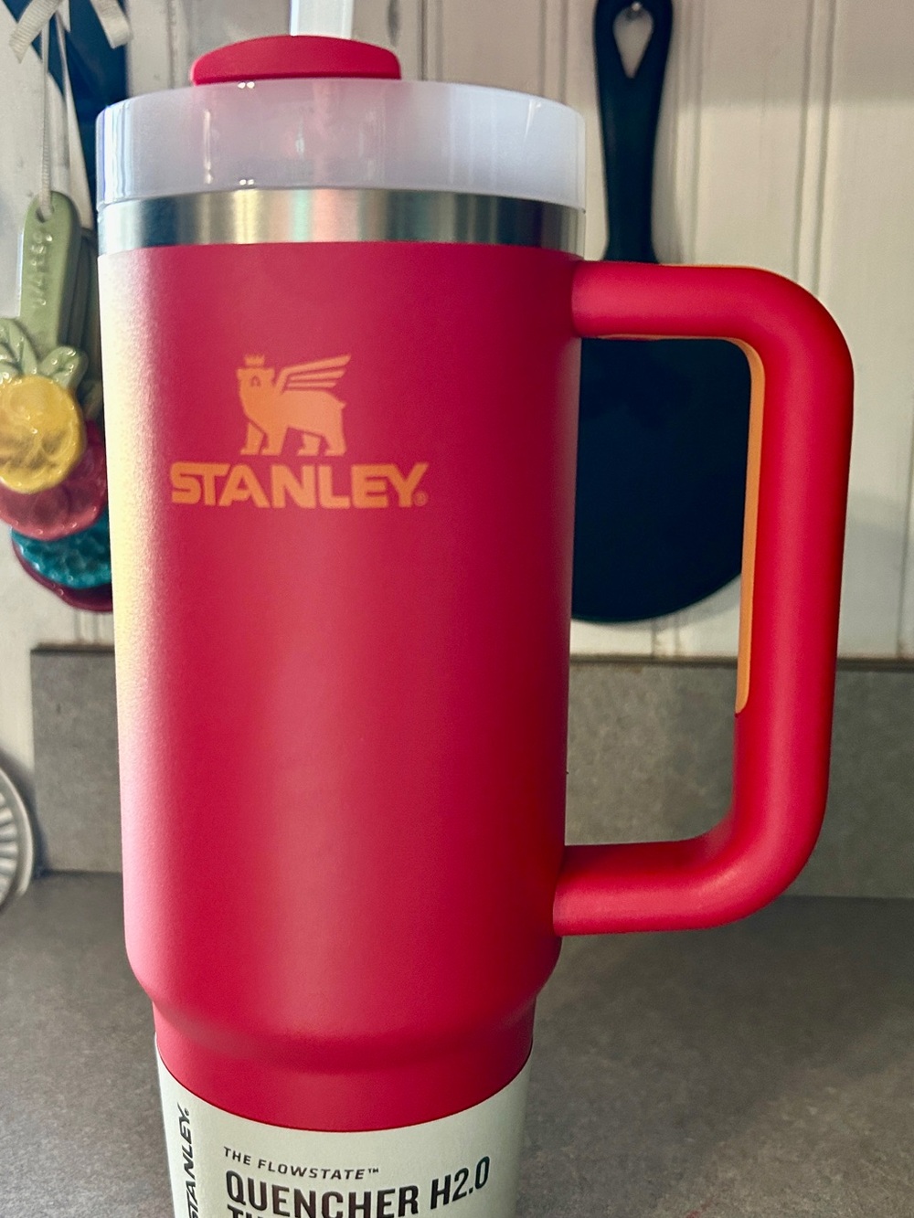 Stanley red 30oz with yellow logo and handle tumbler